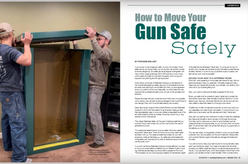 Two men moving a gun safe